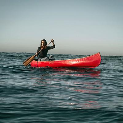 Rachel paddling on open water in kayak